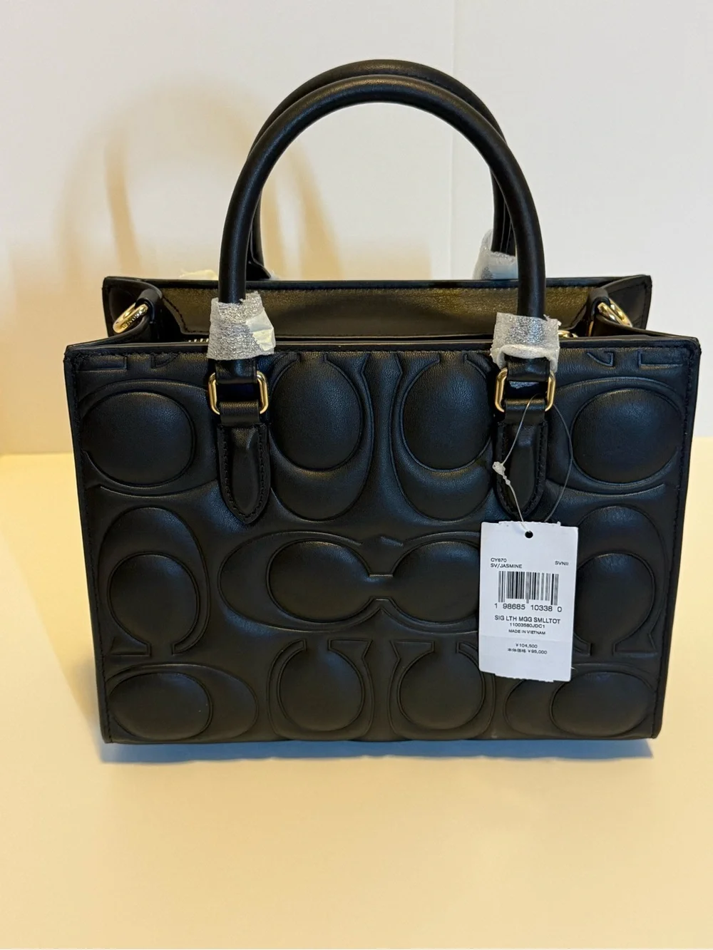 NWT: Maggie small Tote in signature embossed Leather